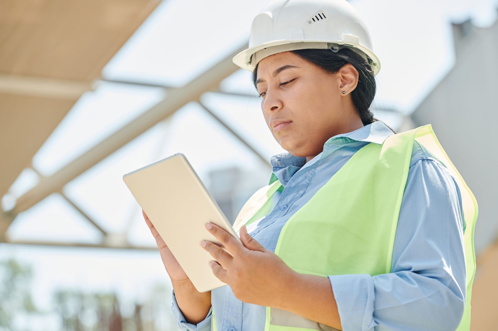 QHSE engineer reviewing compliance on site